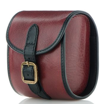 Small red leather bag on white background.