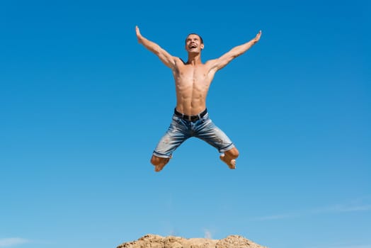 man jumping on the blue sky background, a good time