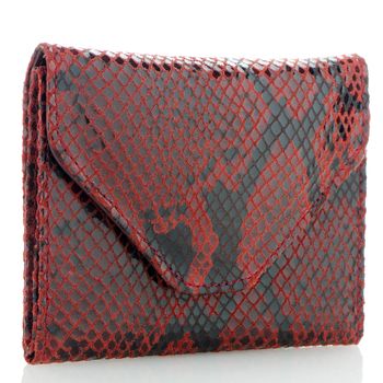 Red snake skin purse isolated on white background.