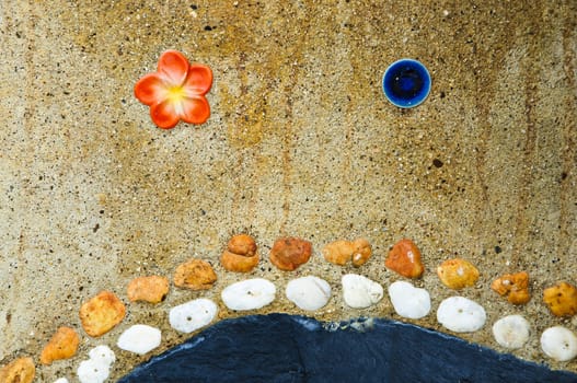 Art form with stones used as components in a wall