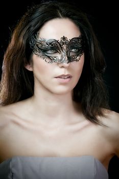 close-up portrait of sexy brunette woman with carnival venetian mask