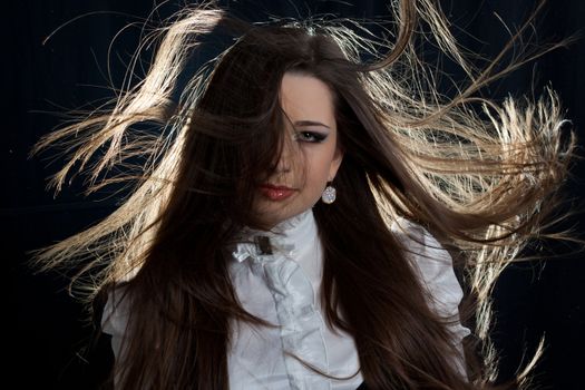 beautifull brunette , shooting in the studio with dark background 