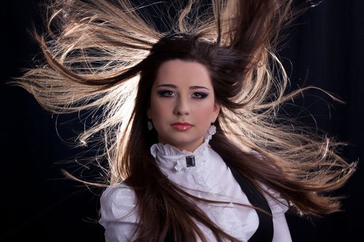 beautifull brunette , shooting in the studio with dark background 