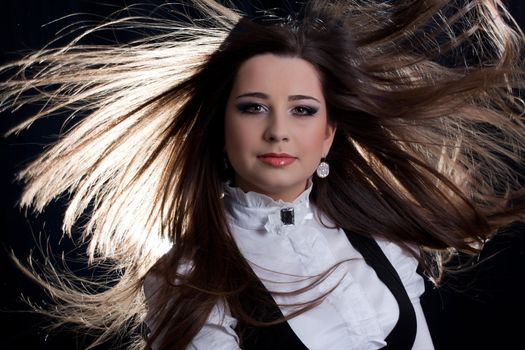 beautifull brunette , shooting in the studio with dark background 