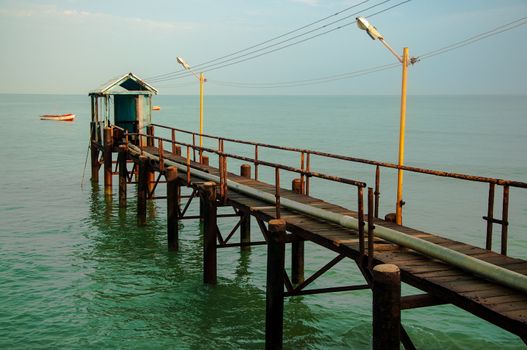 A view of a pier looking out into the ocean.