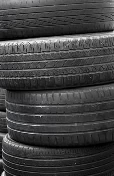 A stack of worn out rubber tire 