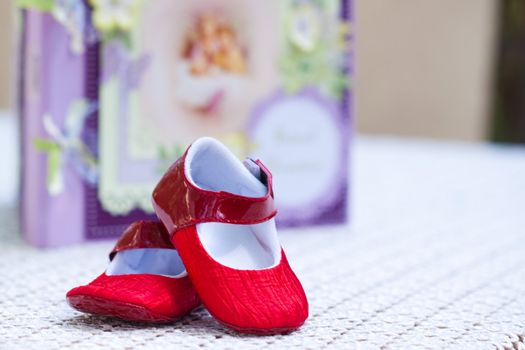 bebe shoes with a notbook with angles in the background