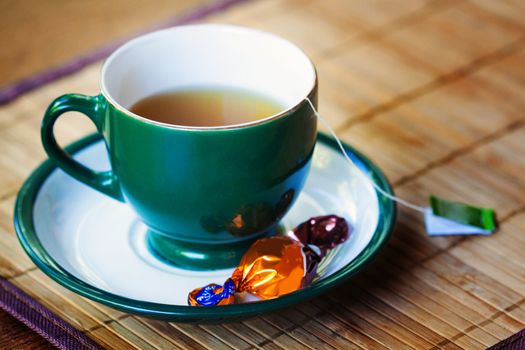 a close up of a cup of coffee on the table 