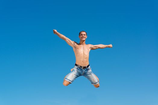 man jumping on the blue sky background, a good time