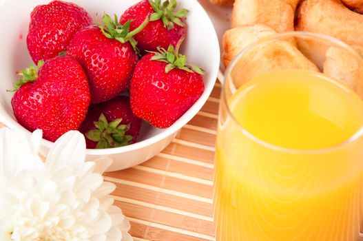 Breakfast with berries,orange juice and croissant, early breakfast