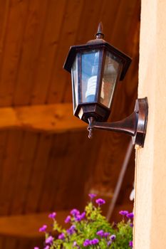 a close up picture of a lantern on the wall