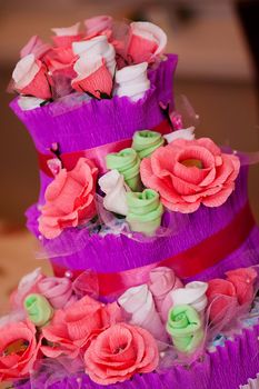 Decorative Cake made of flowers and new babe born's accessories