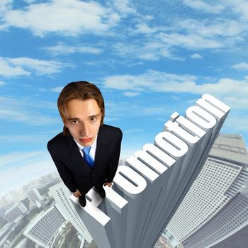 Businessman in suit standing on the word Promotion