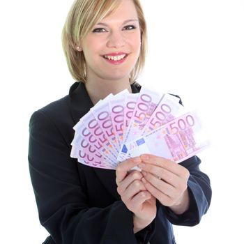 Friendly smiling young blonde woman holding many 500 Euro notes isolated on white