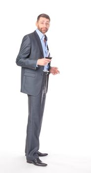 Full length portrait of cheerful business man with glass wine, over white background
