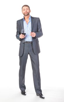 Full length portrait of cheerful business man with glass wine, over white background