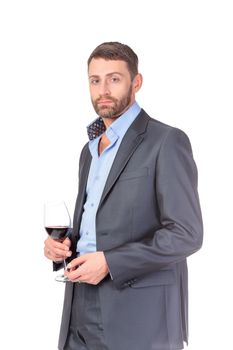 Portrait of thoughtful business man with glass wine, over white background