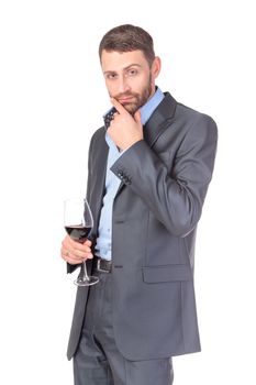 Portrait of thoughtful business man with glass wine, over white background