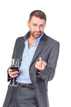 Portrait business man with glass wine, showing obscene gestures, over white background
