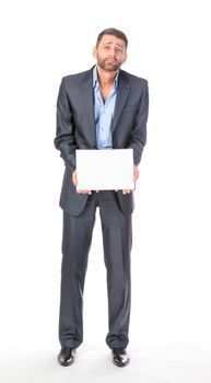 Full length portrait businessman showing an empty board to write, over white background