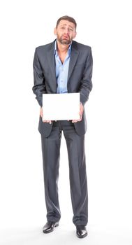 Full length portrait businessman showing an empty board to write, over white background
