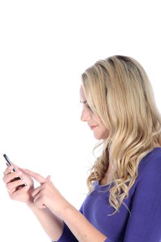 Friendly young blonde woman dialing on a cell phone isolated on white