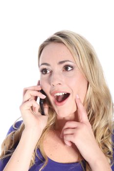 Smiling young blonde woman talking on cell phone and touching face with finger isolated on white