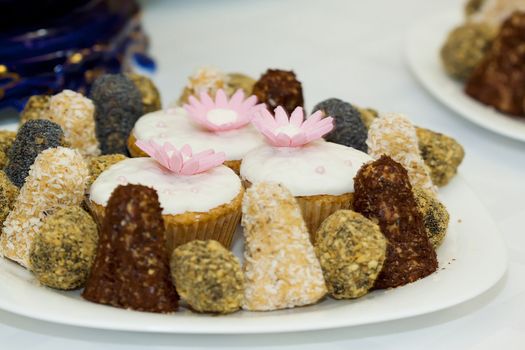 A close up picture of a plate with sweets