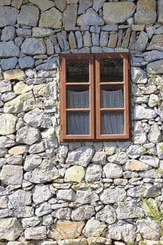 Window on old stone wall