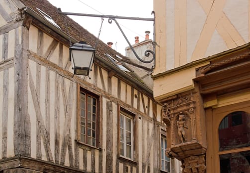 city of Auxerre, medieval decoration in the angle of a street  (Burgundy France)