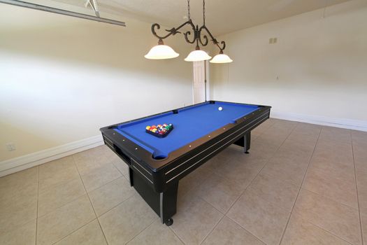 A pool table in a garage in Florida