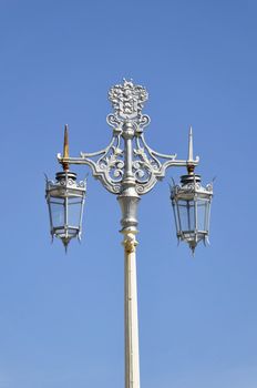 Vintage street lamp, blue sky background