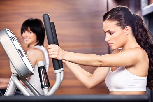 Women doing exercise in gym center