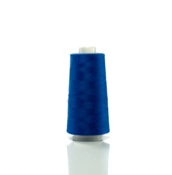  bobbin with green thread isolated on white