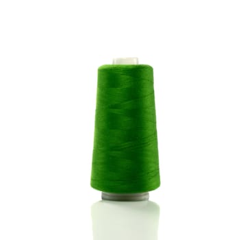  bobbin with green thread isolated on white