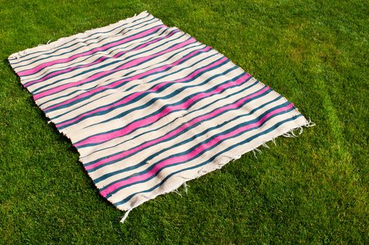 colorful picnic blanket on the grass field
