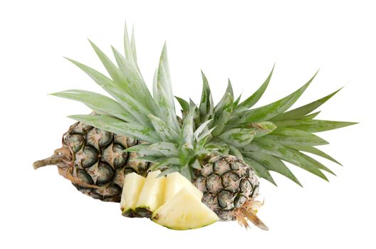 raw  pineapple and  piece of pineapple  on white 