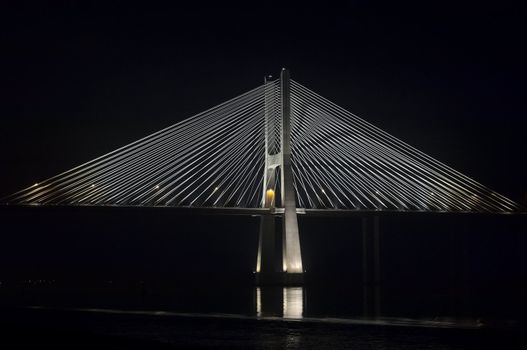 Vasco da Gama bridge over Tagus river in a dark night, Lisbon, Portugal