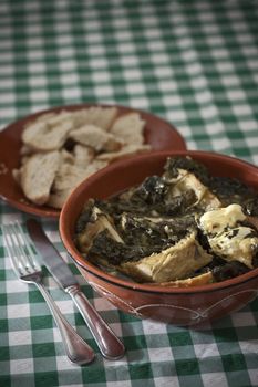 Real food photographed on location in traditional portuguese restaurants, purslane soup with codfish - sopa de beldroegas - Alentejo, Portugal