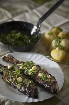 Real food photographed on location in traditional portuguese restaurants, grilled largemouth bass - achigã grelhada - Alentejo, Portugal