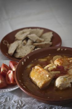 Real food photographed on location in traditional portuguese restaurants, tomato soup with codfish - sopa de tomate, tomatada - Alentejo, Portugal