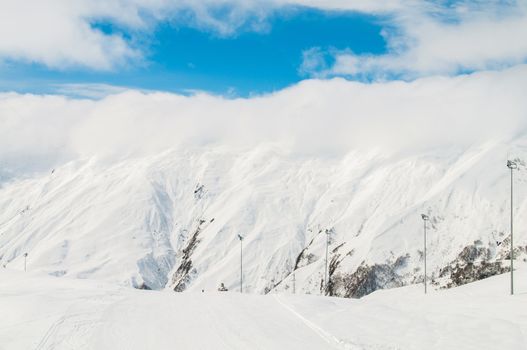 Snow mountains on bright winter day