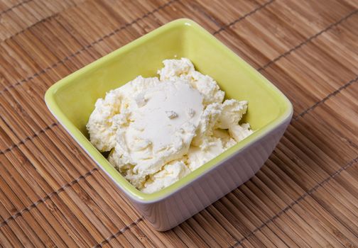 Fresh Italian cheese mascarpone in a bowl.