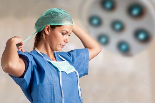 Young female surgeon getting ready for a surgery