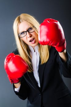 Woman boxer in dark room