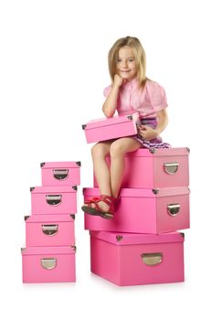 Little cute girl with lots of boxes