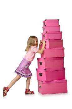 Little cute girl with lots of boxes