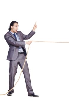 Businessman pulling rope on white