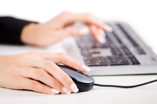 Hands working on the keyboard
