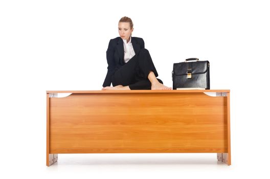 Woman businesswoman sitting on the desk